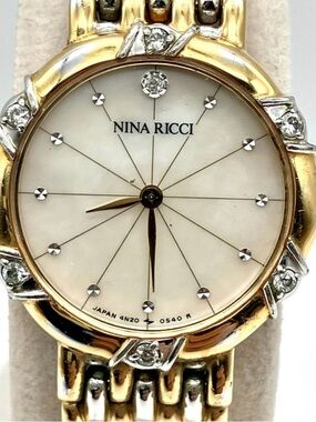 Nina Ricci Gold and Silver Crystal Accent Mother-of-Pearl Dial Watch